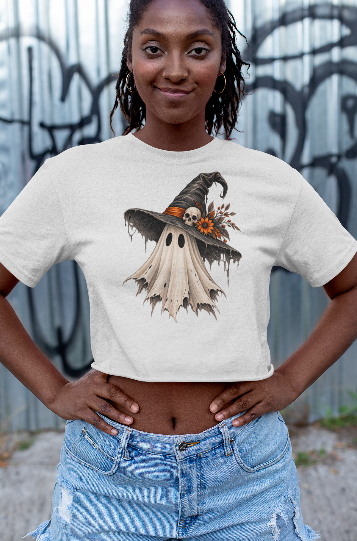 Halloween T-shirt, featuring a tattered ghost wearing a witch hat with skull and Flower accent