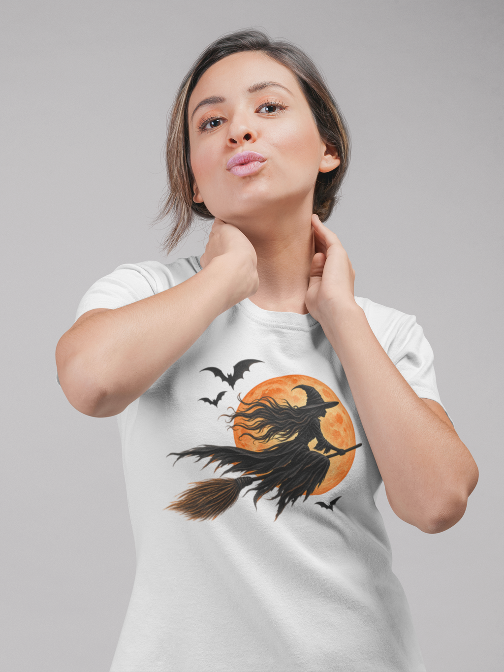 Halloween T-shirt, featuring a witch flying across the moon with bats