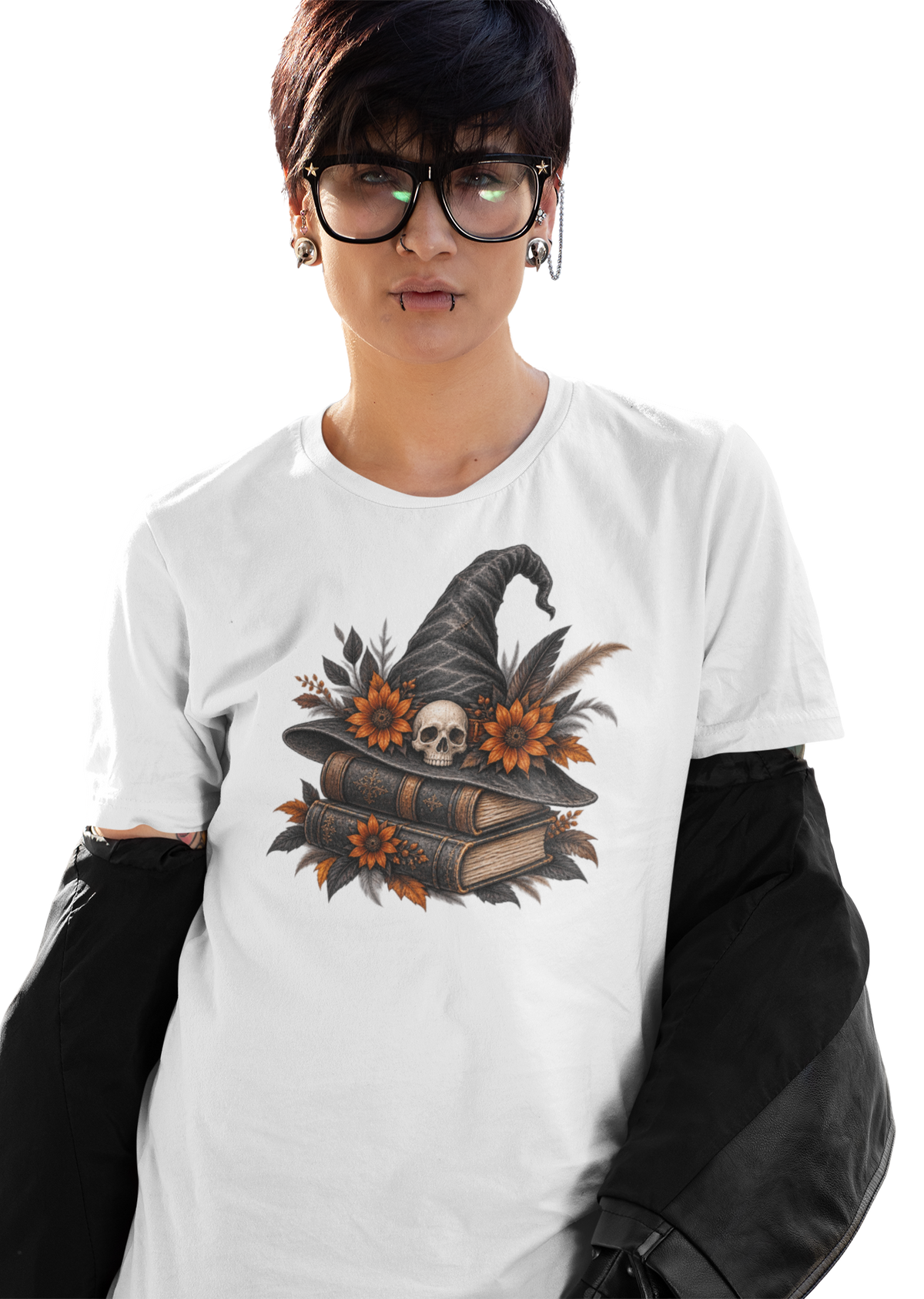 Halloween T-shirt, featuring a witch hat, skull, and flowers resting on stacked books